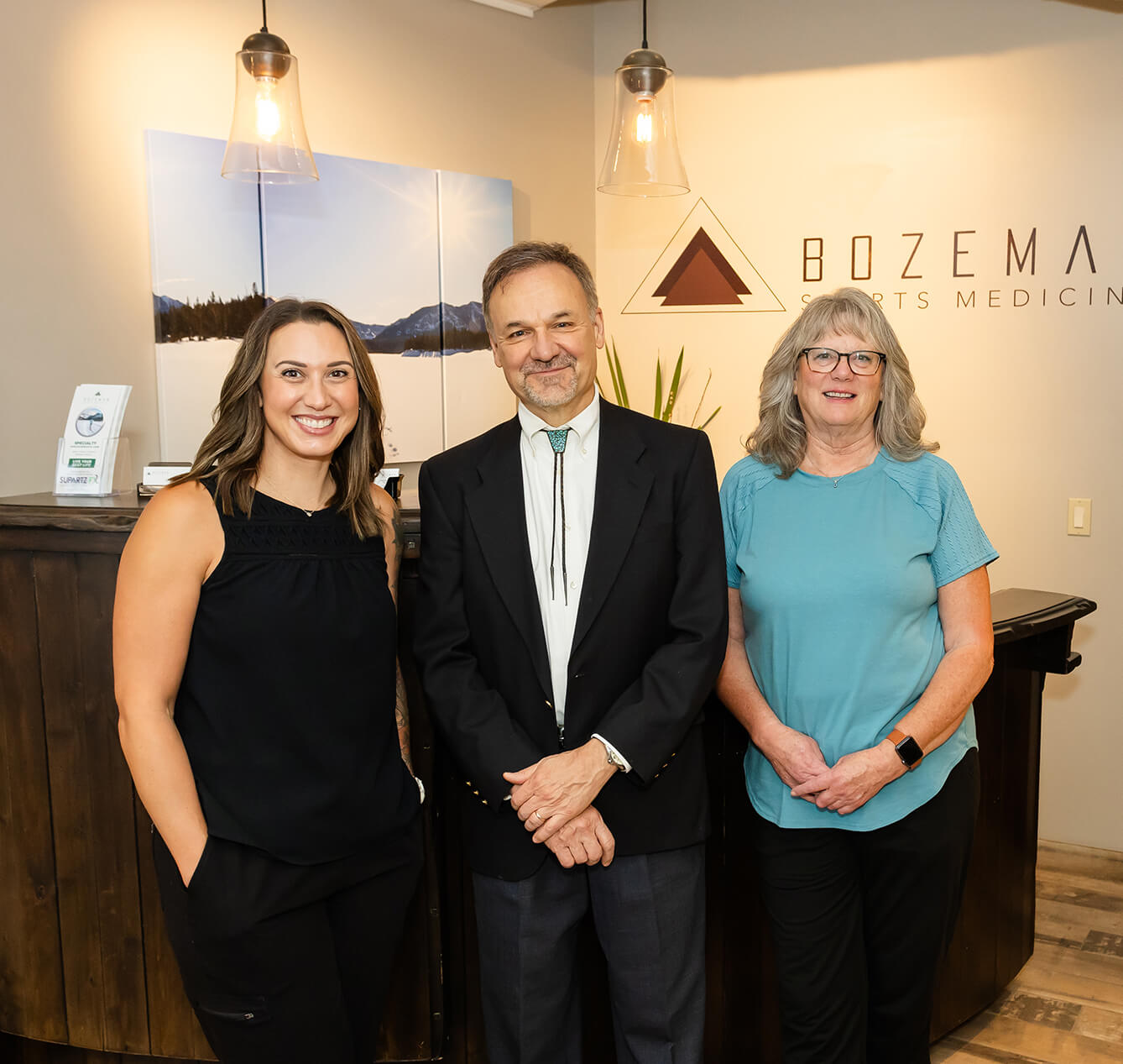 The team at Bozeman Sports Medicine standing in their front office